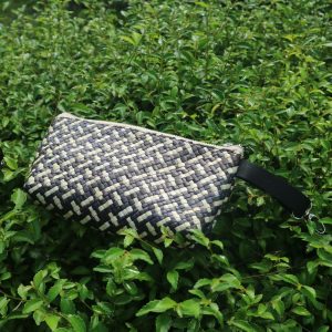 Amani pouch made from traditional pandan weaving, offering a natural and elegant design. Crafted from pandan leaves, this eco-friendly pouch features a soft, natural color and a neatly woven texture, blending the beauty of handmade craftsmanship with functionality. Ideal for storing small items or as a unique, stylish accessory