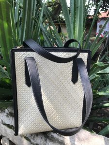 Large woven tote bag made from natural materials, offering a stylish and eco-friendly design for everyday use